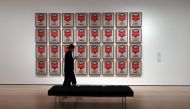 A woman walks past Andy Warhol 