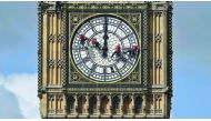 Cleaners abseil down one of the faces of Big Ben to clean and polish the clock face above the Houses of Parliament in central London, August 19, 2014. Reuters/Toby Melville