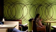 People sleep inside a McDonalds restaurant at midnight hours at Tsim Sha Tsui district in Hong Kong, January 23, 2018. Reuters / Bobby Yip