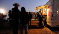 People wait for food from a mobile vendor at the Utah, Navajo Fair in Bluff, Utah, US, October 28, 2017. Reuters / Andrew Cullen