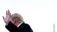 US President Donald Trump waves as he turns away from answering questions from reporters to depart for travel to Mississippi from the South Lawn of the White House, November 1, 2019. Reuters/Tom Brenner
 