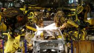 Peugeot 208 automobiles are assembled at the PSA-Peugeot Citroen plant in Poissy near Paris, May 15, 2013. Reuters