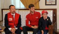 A handout picture released by the official Syrian Arab News Agency (SANA) on November 7, 2019, shows 11-year-old boy Alvin (R) at a meeting to hand him over to representatives of the International Federation of Red Cross and Red Crescent Societies (IFRC) 