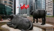 A Chinese national flag and Hong Kong flag are hoisted outside the Hong Kong Stocks Exchange, June 7, 2016. Reuters / Bobby Yip