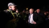 Britain's Prime Minister Boris Johnson visit a flood-affected area in Matlock, northern England, on November 8, 2019. AFP / POOL / Danny Lawson
