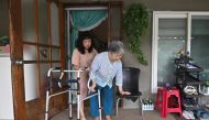 This picture taken on August 30, 2019 shows Emma Sumampong (L) helping her mother-in-law Kim Geum-nyeo (R) during an interview with AFP at her house in the mountainous town of Hoengseong. AFP / Jung Yeon-je