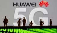 Small toy figures are seen in front of a displayed Huawei and 5G network logo in this illustration picture dated March 30, 2019. Reuters / Dado Ruvic