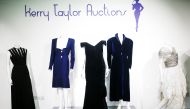Britain's Princess Diana's Victor Edelstein midnight-blue velvet evening gown (estimated at £250,000 - £350,000), which was worn by the princess when she danced with actor John Travolta at the White House in 1985. Also pictured is her Katherine Cusack eve