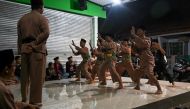 This picture taken on December 14, 2019 shows pencak silat practitioners, a martial art indigenous to Southeast Asia, taking part in a session in Jakarta. AFP / BAY ISMOYO