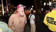 File photo of a Trump supporter yells at anti-Trump protesters outside the Trump International Hotel in Las Vegas. Ethan Miller / Getty Images / AFP