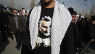 An Iranian, wearing a t-shirt with a picture of slain commander Qasem Soleimani, takes part in a demonstration in Tehran on January 3, 2020. AFP / Atta Kenare
