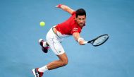  Novak Djokovic of Serbia hits a return in his men's singles match against Denis Shapovalov of Canada at the ATP Cup tennis tournament in Sydney on January 10, 2020. -- I
/ AFP / William WEST /