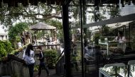 People relaxing at the eco-friendly Bangkok Treehouse hotel in Bang Krachao, the so-called Green Lung of Bangkok on November 4, 2016. AFP / Lillian Suwanrumpha