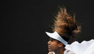 Japan's Naomi Osaka serves against Czech Republic's Marie Bouzkova during their women's singles match on day one of the Australian Open tennis tournament in Melbourne on January 20, 2020. AFP / William West 