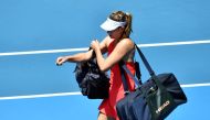 Russia's Maria Sharapova (R) leaves after her defeat against Croatia's Donna Vekic during their women's singles match on day two of the Australian Open tennis tournament in Melbourne on January 21, 2020. (AFP / John DONEGAN)