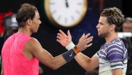 Spain's Rafael Nadal (L) congratulates Austria's Dominic Thiem on his victory in their men's singles quarter-final match on day ten of the Australian Open tennis tournament in Melbourne on January 30, 2020.