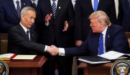 File photo: Chinese Vice Premier Liu He and US President Donald Trump after signing phase one of the US-China trade agreement in the White House, January 15, 2020. Reuters / Kevin Lamarque 
 