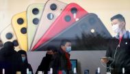 People wearing protective masks are seen in an Apple Store, as China is hit by an outbreak of the new coronavirus, in Shanghai, China, January 29, 2020. Reuters/Aly Song