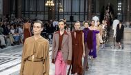 Models present creations from designer Victoria Beckham during the Spring Summer 2020 collection on the third day of London Fashion Week on September 15, 2019. AFP / Niklas Halle'n
