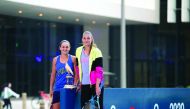 Ashleigh Barty (left) and Karolína Plískova  posing for photographs following a friendly match played at Msheireb Downtown Doha.
