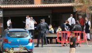 Emergency workers rest at a health control outside of H10 Hotel, which is on lockdown after novel coronavirus has been confirmed in Adeje, on the Spanish island of Tenerife, Spain February 25, 2020. Reuters/Borja Suarez