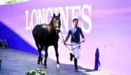 A Qatari rider with his horse during the official vet check.