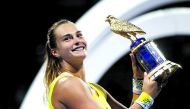 Aryna Sabalenka of Belarus celebrates after winning the WTA Qatar Total Open title at the Khalifa International Tennis and Squash Complex, in Doha, yesterday. 
