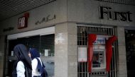 Two women walk past a closed bank office in Beirut, Lebanon, November 15, 2019. Reuters / Andres Martinez Casares