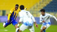 Al Gharafa's Jonathan Kodjia (left) in action yesterday.
