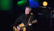 (FILES) In this file photo taken on June 13, 2019 US singer-songwriter John Prine performs onstage during the 2019 Songwriters Hall Of Fame Gala at The New York Marriott Marquis in New York City. / AFP / Angela Weiss