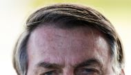 Brazil's President Jair Bolsonaro meets supporters as he leaves Alvorada Palace, as the COVID-19 spread continues, in Brasilia, Brazil March 30, 2020. Reuters/Ueslei Marcelino
 
 
  
 