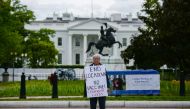 Kathy Boylan protests business closings, amid the spread of the coronavirus disease (COVID-19), in front of the White House in Washington, U.S., April 25, 2020. REUTERS/Erin Scott
