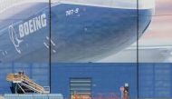FILE PHOTO: A worker leaves the Boeing Everett Factory, amid the coronavirus disease (COVID-19) outbreak, in Everett, Washington, U.S. March 23, 2020. REUTERS/David Ryder/File Photo