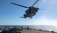 FILE PHOTO: Air detachment members aboard HMCS Fredericton attach a fueling hose on the hoist cable of a CH-148 Cyclone helicopter during Operation Reassurance at sea February 15, 2020, in this picture obtained from social media. Picture taken February 15