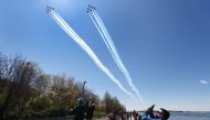NEW YORK, - APRIL 28: The U.S. Navy's Blue Angels and U.S. Air Force's Thunderbirds perform a flyover across Brooklyn Bridge park as a tribute to honor NYC COVID-19 frontline workers on April 28, 2020 in the Brooklyn borough of New York City. The World He