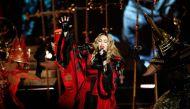 (FILES) In this file photograph taken on December 9, 2015, US singer Madonna performs during a concert at The AccorHotels Arena in Paris. Madonna said May 7, 2020, that she has had the coronavirus and that it was why she had to cancel a concert in Paris i