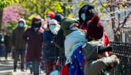 Recipients of the nonprofit organization The River Fund wait in line to receive free groceries on May 9, 2020 in the Queens borough of New York City. (Bryan Thomas/Getty Images/AFP)