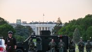 SWAT personnel stand with their vehicle outside the White House during a protest amid nationwide unrest over the death in Minneapolis police custody of George Floyd, in Washington, U.S., May 31, 2020. REUTERS/Erin Scott
