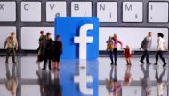 FILE PHOTO: A 3D printed Facebook logo is placed between small toy people figures in front of a keyboard in this illustration taken April 12, 2020. REUTERS/Dado Ruvic/Illustration
