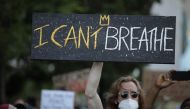 WASHINGTON, USA - JUNE 2: A person holds a banner during a protest over the death of George Floyd, an unarmed black man who died after being pinned down by a white police officer in Minneapolis, United States on June 2, 2020 in Washington, United States. 