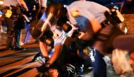 Police detain protesters for blocking traffic during a rally against racial inequality and the police shooting death of Rayshard Brooks, in Atlanta, Georgia, U.S. June 13, 2020. REUTERS/Elijah Nouvelage
