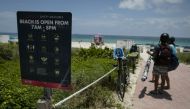 FLORIDA, USA - JUNE 10: A sign with COVID-19 safety measures is seen on the beach as Miami reopens beaches after measures against the novel coronavirus (COVID-19) began to be lifted in Miami Beach, Florida, United States on June 10, 2020. ( Eva Marie Uzca