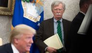 (FILES) In this file photo National Security Adviser John Bolton stands alongside US President Donald Trump as he speaks during a meeting with NATO Secretary General Jens Stoltenberg in the Oval Office of the White House in Washington, DC, May 17, 2018. A