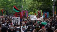 TOPSHOT - Protesters hold 