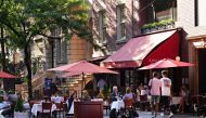 Customers at Amaranth are served at outside tables as the city moves into Phase 2 of re-opening following restrictions imposed to curb the coronavirus pandemic on June 23, 2020 in New York City. Cindy Ord/Getty Images/AFP
