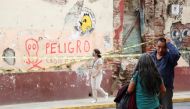 People talk near a building damaged during a quake, in Oaxaca, Mexico June 24, 2020. REUTERS/Jorge Luis Plata/File Photo
 