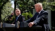 Poland's President Andrzej Duda listens to U.S. President Donald Trump during a joint news conference in the Rose Garden at the White House in Washington, U.S., June 24, 2020. REUTERS/Carlos Barria