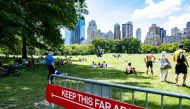 People enjoy the weather in Central Park, the day before the city starts phase two of reopening after the lockdown due to the coronavirus disease (COVID-19), in the Manhattan borough of New York City, U.S., June 21, 2020. REUTERS/Jeenah Moon
