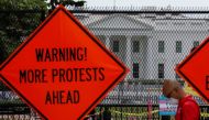 Sings are seen on the fence surrounding the White House as racial inequality protests continue in Washington, U.S., June 27, 2020. REUTERS/Yuri Gripas