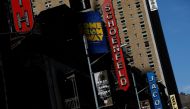 FILE PHOTO: A row of closed theaters are seen in the Broadway district due the outbreak of the coronavirus disease (COVID-19) in Manhattan, New York City, U.S., May 15, 2020. REUTERS/Andrew Kelly/File Photo
